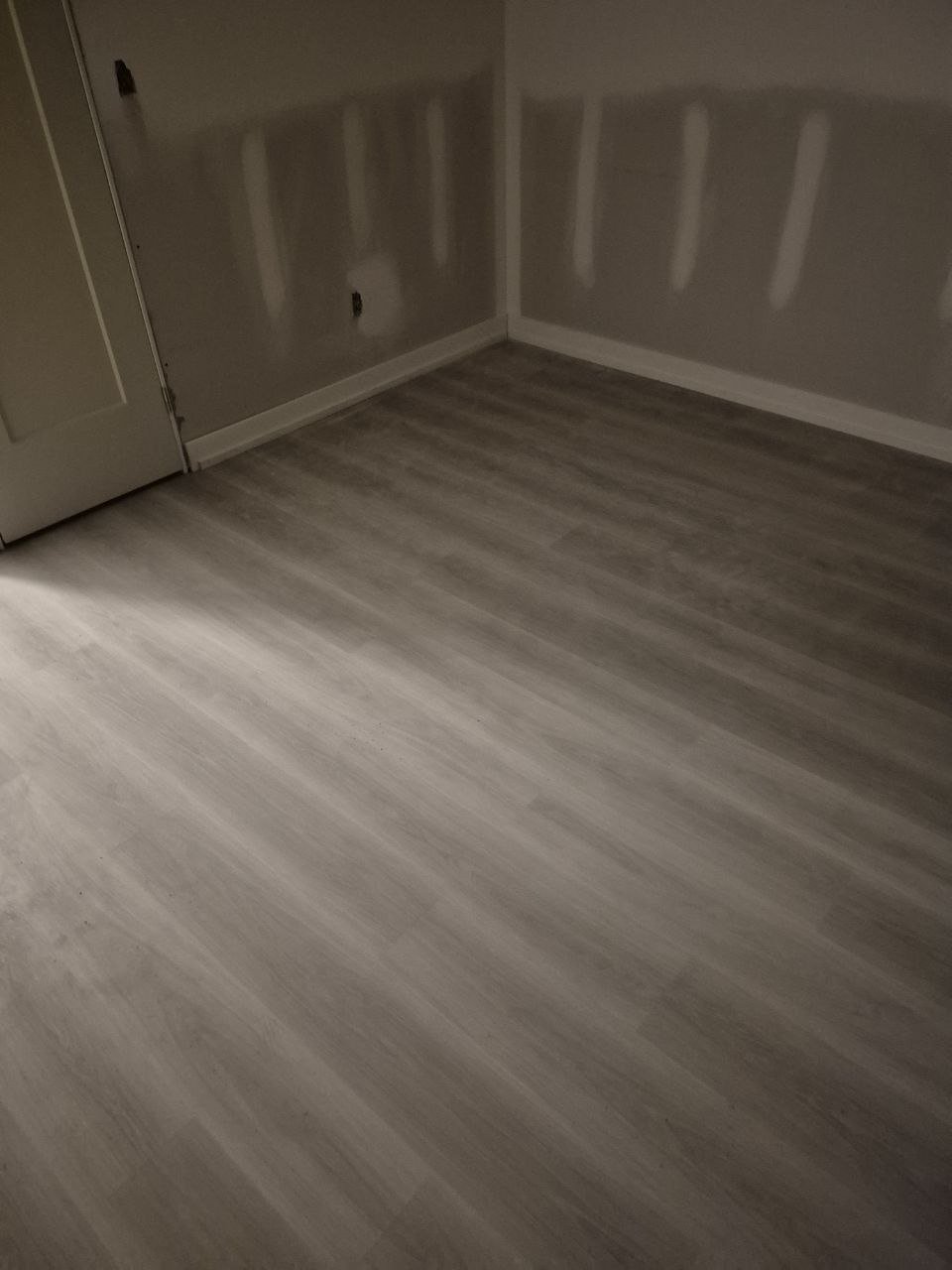 Vinyl plank flooring with baseboard installation
