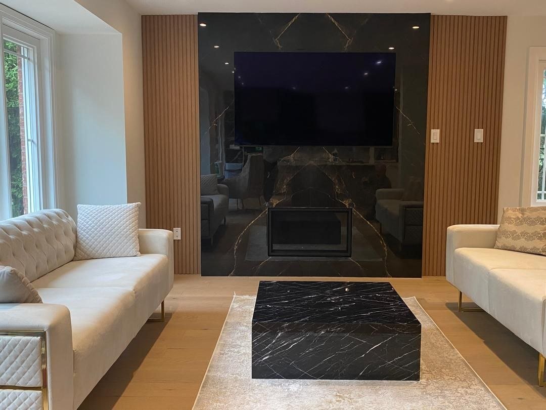 Living room feature wall with marble and wood slat panelling